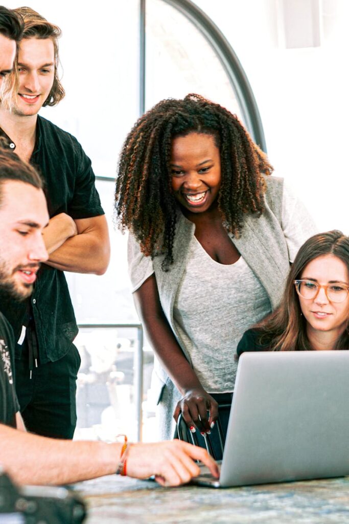 pexels photo 3153201 3153201 Dynamic team of young adults collaborating on project in bright modern office environment.